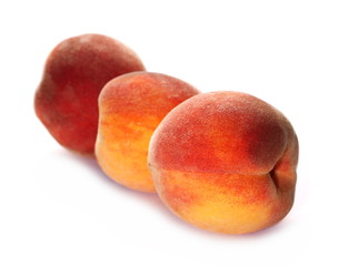 Ripe peaches isolated on white background