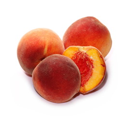 Ripe peaches with slices isolated on white background