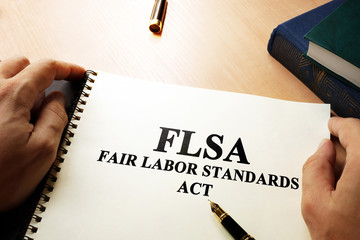 Fair Labor Standards Act (FLSA) on an office table.