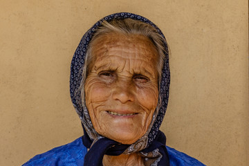 Portrait of a beautiful wrinkled smiling old women