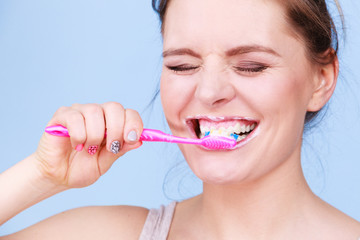 Woman brushing cleaning teeth
