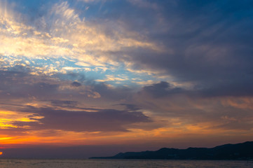 Obraz premium Amazing sea sunset, the sun, waves, clouds