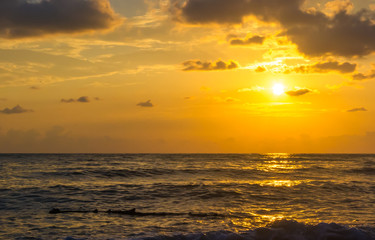 Amazing sea sunset, the sun, waves, clouds