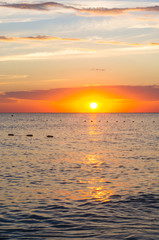 Amazing sea sunset, the sun, waves, clouds