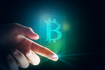 Finger tip with bitcoin