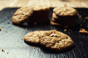 Biscuit sweet cookie background. Domestic stacked butter biscuit pattern concept,close up macro.Homemade cookies on wooden table.Cereal biscuits with the sesame,peanuts,sunflower and amaranth.