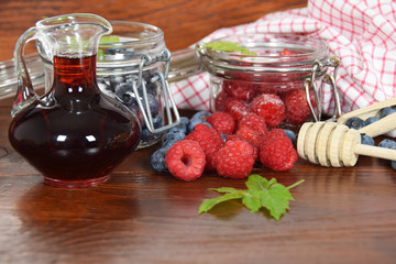 blueberries and raspberries in jars for the winter tea