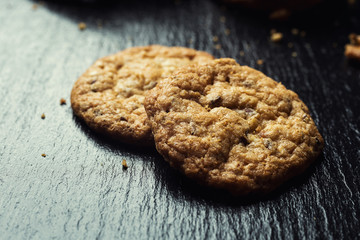 Biscuit sweet cookie background. Domestic stacked butter biscuit pattern concept,close up macro.Homemade cookies on wooden table.Cereal biscuits with the sesame,peanuts,sunflower and amaranth.