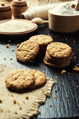 Biscuit sweet cookie background. Domestic stacked butter biscuit pattern concept,close up macro.Homemade cookies on wooden table.Cereal biscuits with the sesame,peanuts,sunflower and amaranth.