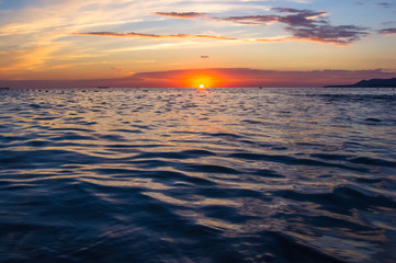 Amazing sea sunset, the sun, waves, clouds