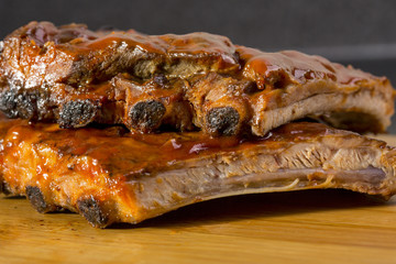 Ribs ala barbiquiu with potatoes in the background