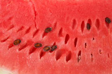 Slice of watermelon with seeds.