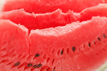 Slice of watermelon with seeds.