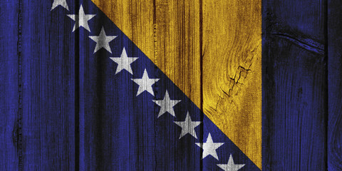 Fototapeta na wymiar Bosnia and Herzegovina flag painted on wooden wall for background