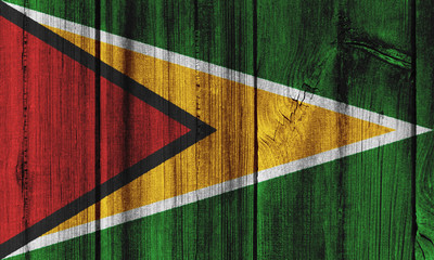 Guyana flag painted on wooden wall for background