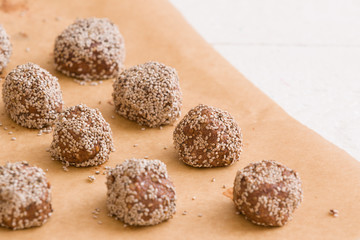 Dark chocolate coconut brownie energy bites.Oatmeal balls / Oats dates energy balls. Vegan sweet delicious nut cocoa balls. Healthy and tasty food concept