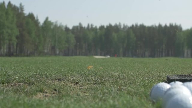 Man playing game of golf. Man hitting Golf ball
