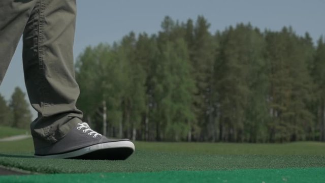 Man playing game of golf. Man hitting Golf ball