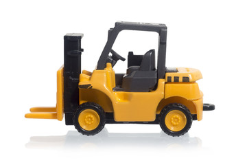 Yellow Forklift toy isolated on white background.