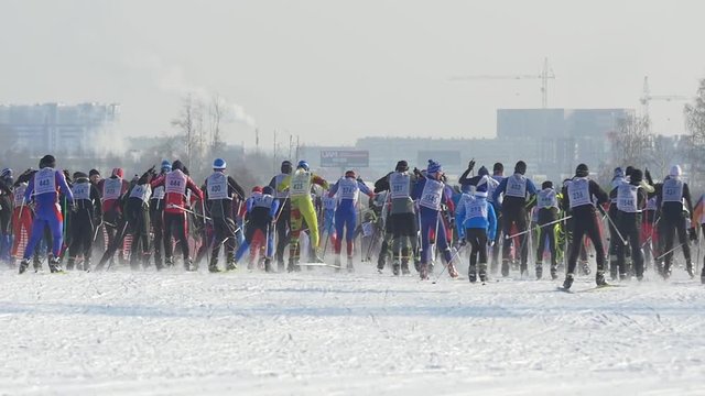 Mass start men athletes skiers during Championship on cross country skiing