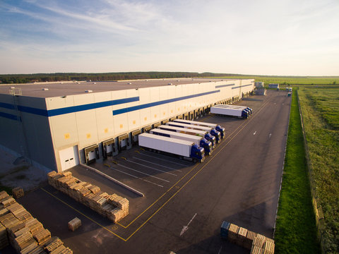 Fototapeta distribution warehouse with trucks of different capacity