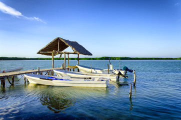 Fototapeta na wymiar Boats on the Waterfront in Rio Lagartos