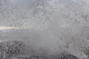 Wall of water from ocean wave splash against rocks Yachats Oregon Coast