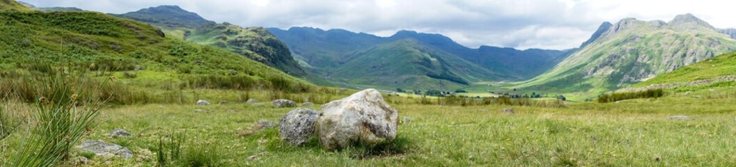 Panorama landscape mountains stone grass meadow