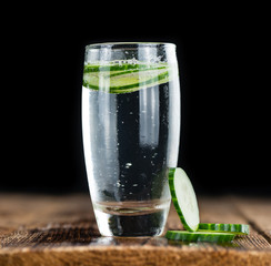 Fresh made Cucumber Water on a rustic background