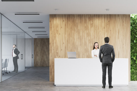 Business people near a reception in office