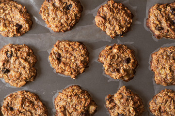 Healthy homemade oatmeal and banana cookies with nuts and raisins.