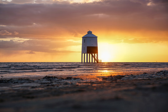 Sunset with wooden lighthouse Burnham on sea