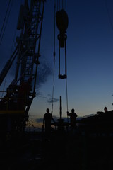 field oil workers at work