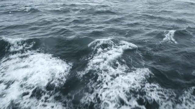 Aerial shot, Waves crash in waters in Iceland