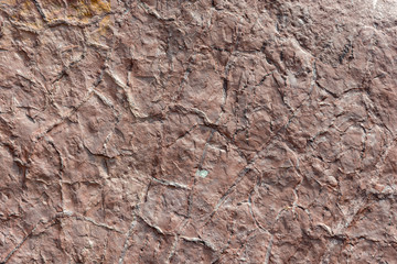 Close up of a red brown stone mountain side texture