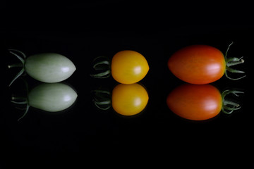 Japanese cherry tomato on black