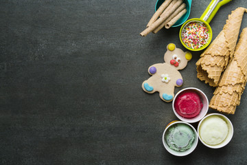 Top view of Ice cream flavors in cup and topping, sweet and dessert food concept