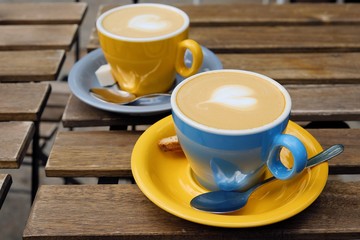 Two cups of delicious cappuccino on a summer day