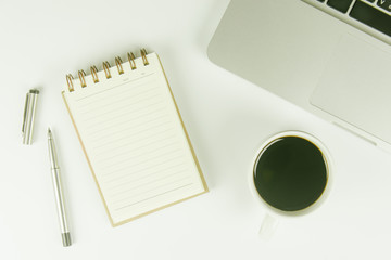 White office desk table with a lot of things on it. Top view with copy space.