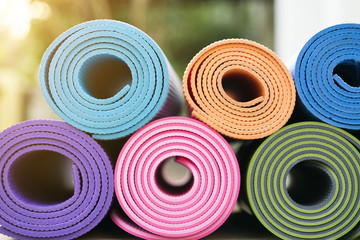 close up colorful of yoga mats in the garden