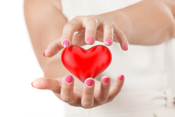 Save Love or Healthcare Concept. Two Woman Hands Protecting Red Heart.