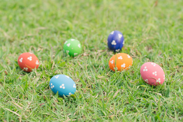 Colorful easter eggs on green grass