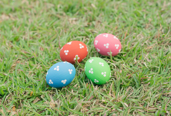 Colorful easter eggs on green grass