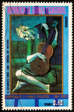 Painting The Old Guitarist by Picasso on postage stamp
