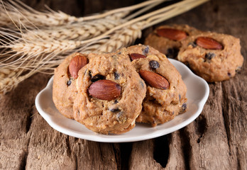 homemade almond cookies on wooden background.