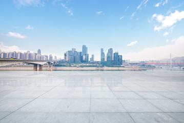 Empty floor with modern skyline and buildings
