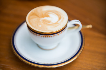 cup of mocha with milk foam in,cafe