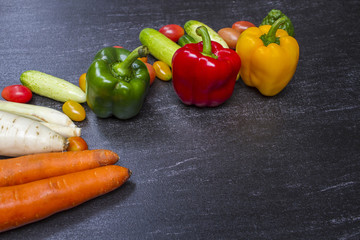 Organic vegetables on dark background concept.Top view with copy space. Raw food background.