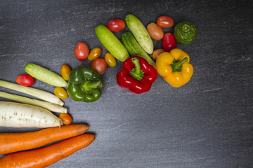 Organic vegetables on dark background concept.Top view with copy space. Raw food background.