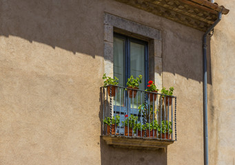 Fototapeta na wymiar Balcony with flowers in Girona, Spain